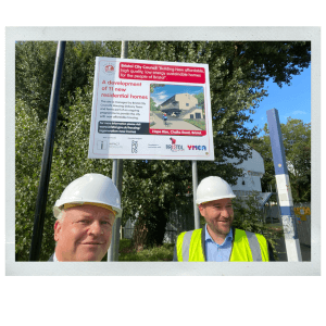 Jim and Rob in front of Hope Rise development sign 